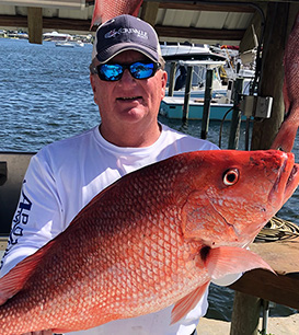 Hugh Dailey holding a large fish