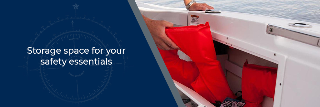 Storage space for your safety essentials - Image of a person putting a life jacket in a storage area on the side of a boat