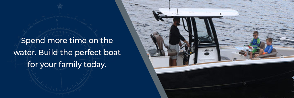 Spend more time on the water. Build the perfect boat for your family today. - Man steers at center console while children dine at a table and chairs on the deck