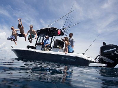 Crevalle family-friendly fishing boat - children are jumping in the water while the adults watch