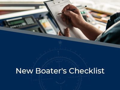 New Boater's Checklist - image of a boater at the controls holding a clipboard
